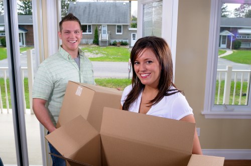Professional packers preparing boxes for a move in Manwithvan SW 10